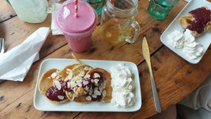 My sweet course: Delux Cherry Bakewell Protein Pancakes (£5.50). Drink is a smoothie. at Guilt Free Pleasures in Hucknall