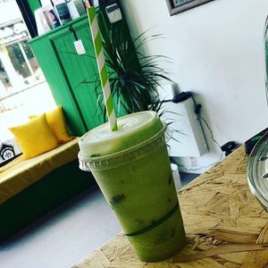 Green juice in vegware plastic free cup at Guilt Free Pleasures in Hucknall