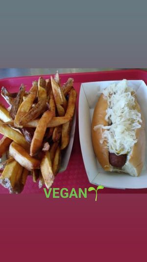 Our HandMade VEGAN Sausage prepared New York Style with Sauer Kraut and a side of Hand Cut Fries. at Gourmet Killer Dogs in Delray Beach
