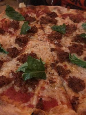 Marghertta with vegan cheese and sausage at Delarosa - Chestnut St in San Francisco