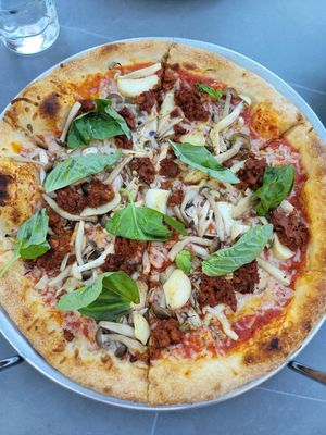 margherita pizza sub for vegan cheeze add veg sausage and fungi at Delarosa - Chestnut St in San Francisco