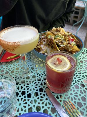 Nachos, pineapple chili cocktail and pomegranate jalapeño cocktail  at Jajaja Mexicana - West Village in New York City