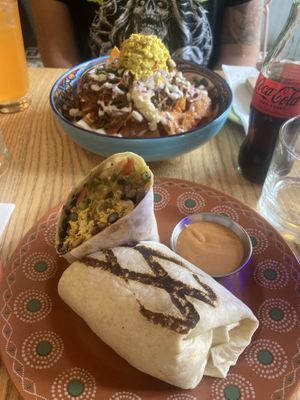Background - nachos. Foreground - burrito  at Jajaja Mexicana - West Village in New York City