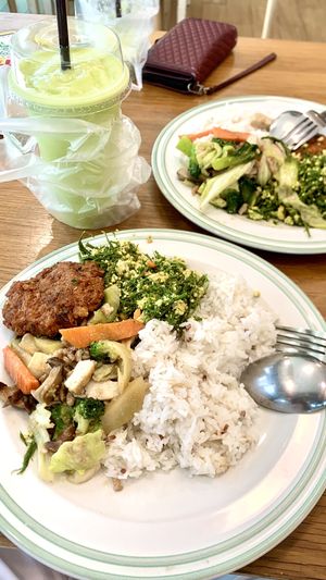 Precooked vegetarian food is servers till noon at a very affordable price. Rice with Stir fried mixed vegetables, stir fried cabbage and Vada.  at Veggie House - บ้านเจ in Pathum Thani