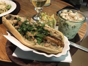 Vegan vegan dog with a creamy mushroom sauce topping, the glass noodle salad with lime dressing and a Mexican coleslaw  at Felis in Essen
