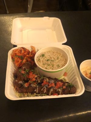Kebab platter, hummus, rice, pita, salad at Ember Lounge in Calgary