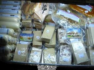 The refrigerated section of the small shop... vegan cheeses and meats. at Loving Hut in Paris