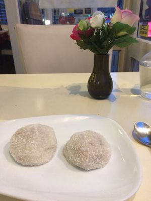 Mochi - stuffed with peanuts, sesame seeds, and coconut.  at Loving Hut in Paris