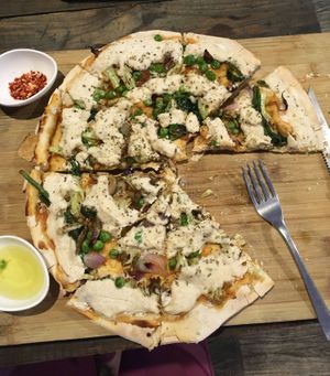 Vegan cheese pizza with peas, broccoli and spinach at Little Windows in Pokhara