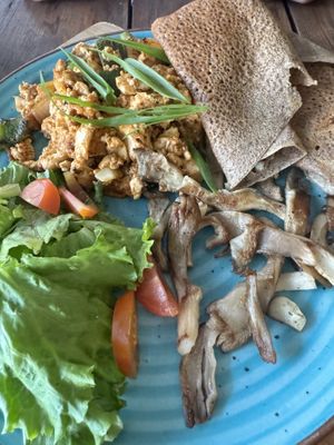 Vegan breakfast with tofu scramble, mushrooms and buckwheat flatbread   at Little Windows in Pokhara