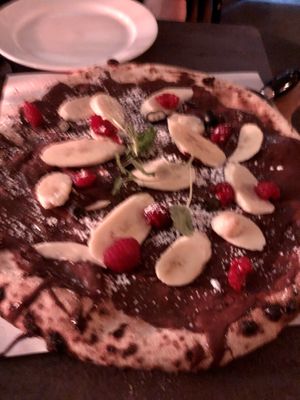 Blurry photo of their nice vegan “nutella pizza"  at Pazzi in Stockholm