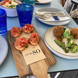 maltese bread crostini with tomatoes and garlic, mashroom croquettes and sautéed seasonal vegetables (all vegan)  at One80 in Mgarr