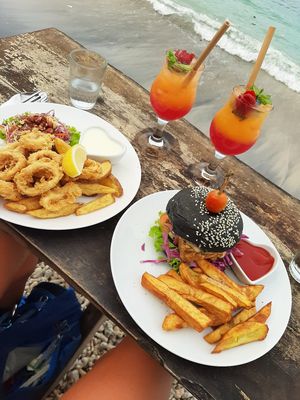 Tempeh Burger and The Golden Hour Cocktail at Penida Colada Beach Bar in Penida Island