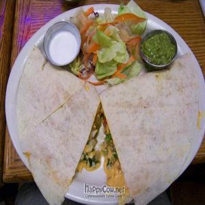 vegan quesadilla with soy chunks and other veggies in it plus salad side and vegan sour cream and gucamole at Papis Tacos Al Carbon in Riverside