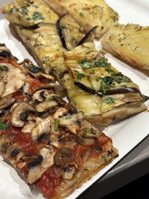 Mushroom, eggplant (so good!), and potato pizzas  at Alice in Lucca
