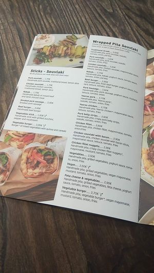 You see the sign V in every vegan dish. Very tasty vegan options!! at Garlic Grill House in Samos