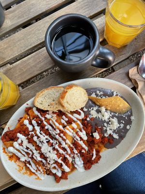 chilaquiles rojos con chorizo  at Café Vegetal in Mexico City