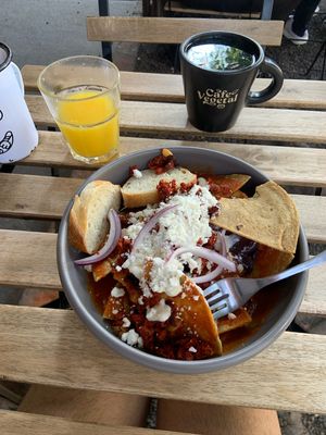 Chilaquiles rojos con chorizo, jugo de naranja y te de menta  at Café Vegetal in Mexico City