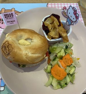 Hummus, peppers and falafel bagel with veg crisps and salad. Fully Vegan  at ARTBOX in Brighton