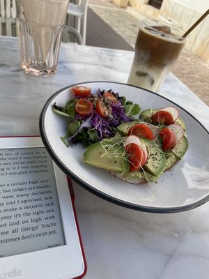 Avocado open toast with iced soya latte   at Sugar Rabbit Kaffé in Albufeira