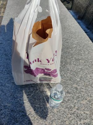 Takeout bag + free water bottle at Aamar in Atlanta