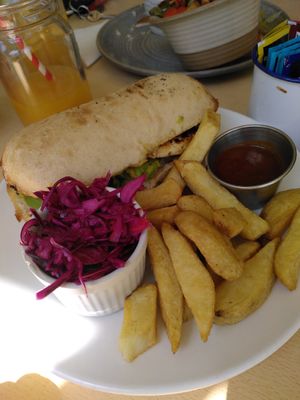 Avocado and jerk tofu ciabatta with chips and lime slaw  (June 2023) at Mama Fay's in Aberystwyth