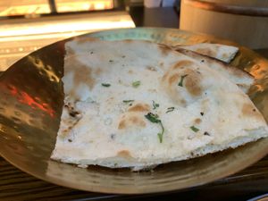 Bread served at start of meal. If you don’t want it tell them or you’ll be charged. It was good but tell them vegan so it doesn’t have butter.  at JNcQUOI Asia in Lisbon