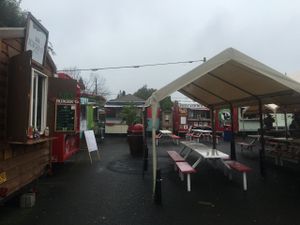 Food pod view with Homegrown far left corner at Homegrown Smoker Vegan Barbecue - Food Cart in Portland