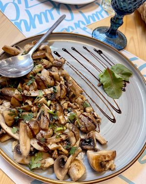 Fried mushrooms with nuts: mushrooms, nuts, garlic, cilantro. at Garun in Yerevan