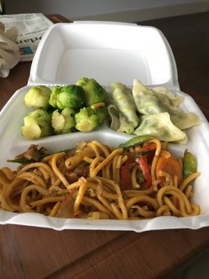 Stir fry peanut noodles with Brussels and steamed dumplings.  at Lakeside Cafe in Orlando