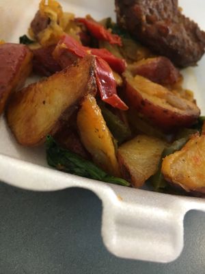 Potatoes with onions and peppers and veg sausage.  at Lakeside Cafe in Orlando