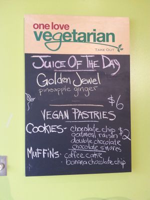 Juice of the day and desserts menu. at One Love Vegetarian in Toronto