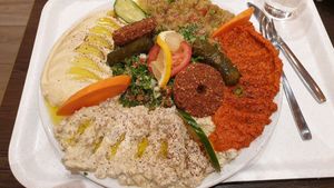 Meze, with hummus, aubergine puree, pepper puree, falafel, tabbouleh etc. at Midan in Stockholm