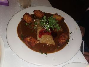 Forester seitan with potato doughnuts and currant jam at Napfényes Restaurant & Confectionery in Budapest