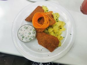 Breaded seitan with parsley potatoes and green peas in "mayonnaise" at Napfényes Restaurant & Confectionery in Budapest