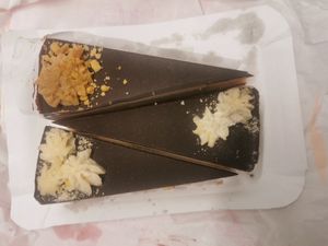 Raw "Tùró Rudi" ("cottage cheese" and chocolate) cake, raw peanut cake at Napfényes Restaurant & Confectionery in Budapest