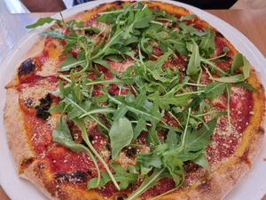 Pizza with pesto and cashew cheese at Napfényes Restaurant & Confectionery in Budapest