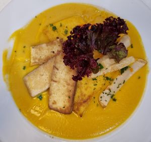 Grilled tofu and polenta with special sauce at Napfényes Restaurant & Confectionery in Budapest