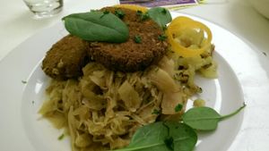 Hungarian Oat Fritters with 
Braised Cabbage and Potatoes at Napfényes Restaurant & Confectionery in Budapest