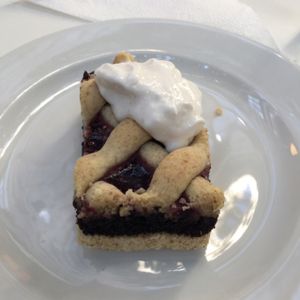 Blueberry pastry with whipped cream at Napfényes Restaurant & Confectionery in Budapest