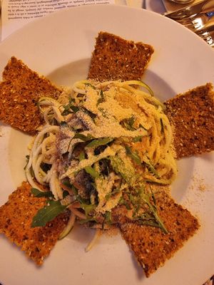 Raw zucchini "spaghetti Bolognese" with cashew parmesan at Napfényes Restaurant & Confectionery in Budapest