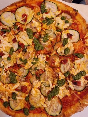 Pizza with pesto and dries tomatoes at Napfényes Restaurant & Confectionery in Budapest