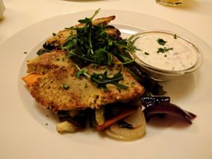 Seitan Cutlets with garlic and mustard. Soy yogurt and herb dressing on side at Napfényes Restaurant & Confectionery in Budapest