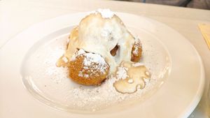 Warm millet dumplings with yogurt sauce at Napfényes Restaurant & Confectionery in Budapest