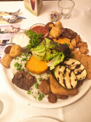 Sharing platter for two. Big plate of food and absolutely delicious. That ketchup is so nice. at Napfényes Restaurant & Confectionery in Budapest