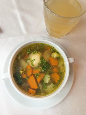 Vegetable soup with semolina dumpling   at Napfényes Restaurant & Confectionery in Budapest