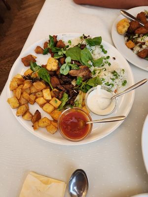 shared platter (we were hungry!) with fried cheese, seitan bites, rizi bizi, and more! at Napfényes Restaurant & Confectionery in Budapest