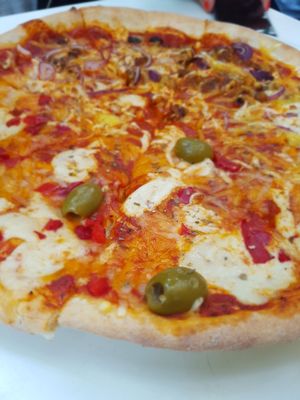 half n half pizza at Napfényes Restaurant & Confectionery in Budapest