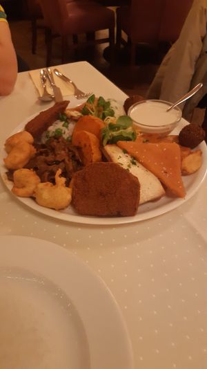 Lavish platter for 2. The brown soy patty at the front is as big as my hand! at Napfényes Restaurant & Confectionery in Budapest