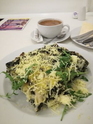 Spinach lasagna with vegan cheese at Napfényes Restaurant & Confectionery in Budapest